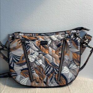 Lug Swivel convertible crossbody bag in the color Lily Gray.